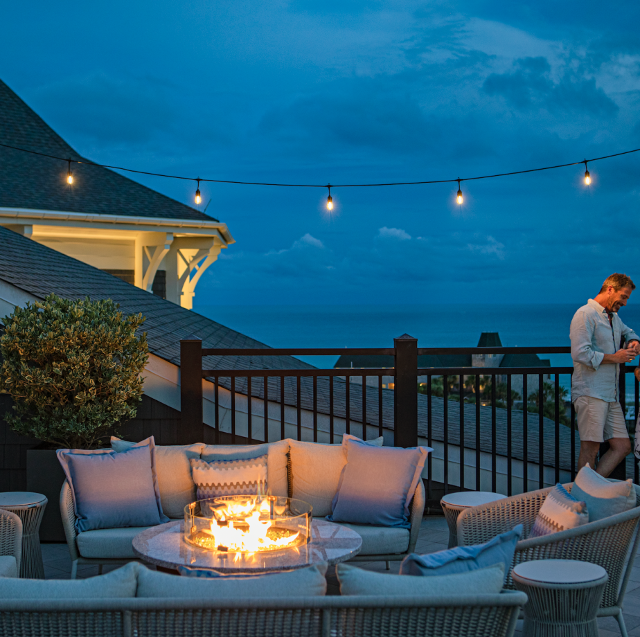 Couple on deck by fire